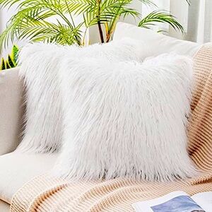 Set of three white faux fur throw pillow covers 22 x 22”.  Zipper closure.